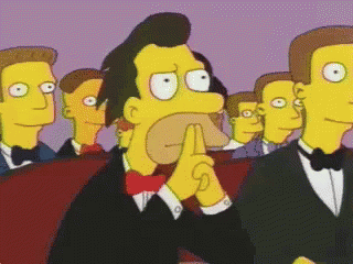 Men In Tuxedos And Bow Ties Watching Cartoon GIF
