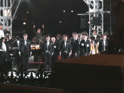 Men in Tuxedos on Stage