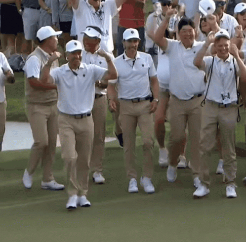 Men In White And Khaki Walking On Green Field GIF