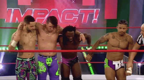 Men In Wrestling Ring With Impact Sign GIF