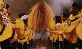Men In Yellow Uniforms Playing Instruments GIF