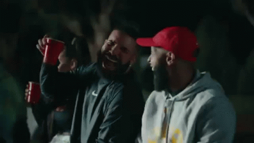 Men Laughing Holding Red Cups