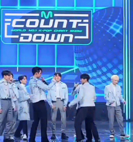 Men on Stage With Countdown Sign