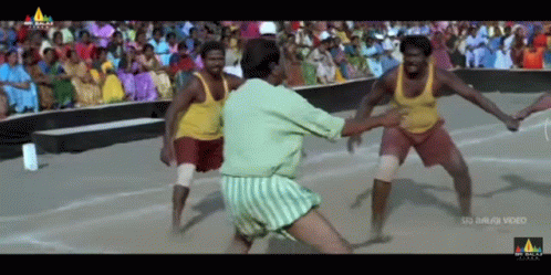 Men Playing Game in Front of Crowd