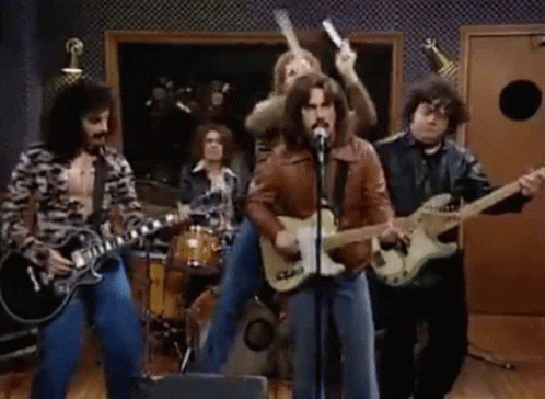 Men Playing Guitars and Singing in Recording Studio