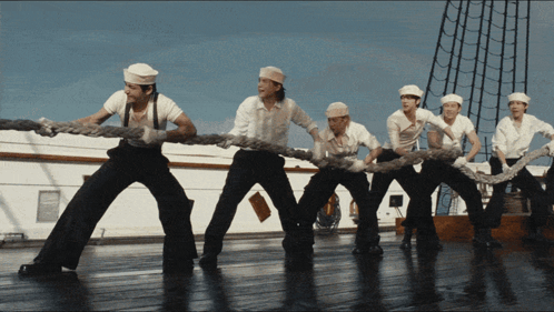 Men Pulling Rope on Ship