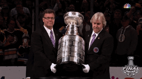 Men Putting Stanley Cup On A Table GIF
