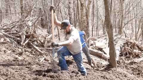 Men Raking Mulch Down The Hill GIF