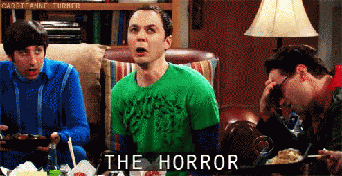 Men Sitting Around Table Saying The Horror