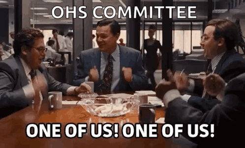 Men Sitting At Table Shouting One Of Us GIF
