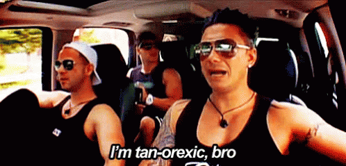 Men Sitting in Car Saying Tanorexic