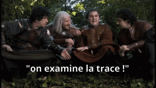 Men Sitting In Woods Say On Examine La Trace GIF