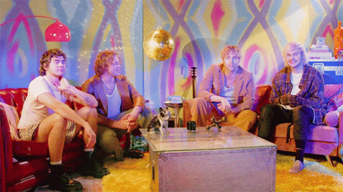 Men Sitting on Couch with Disco Ball