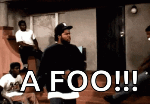 Men Sitting on Steps One Says A Foo