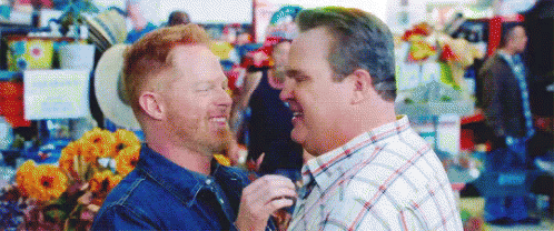 Men Standing In Crowded Market GIF