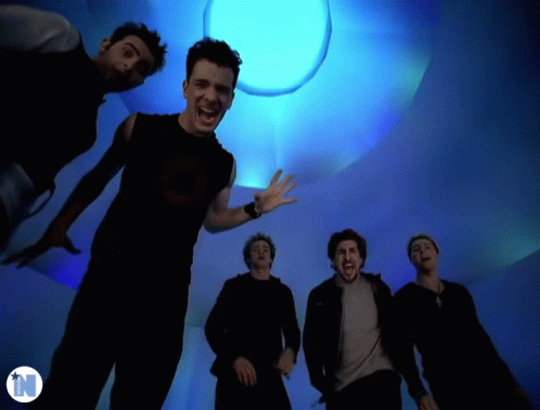 Men Standing In Front Of Blue Light With N GIF