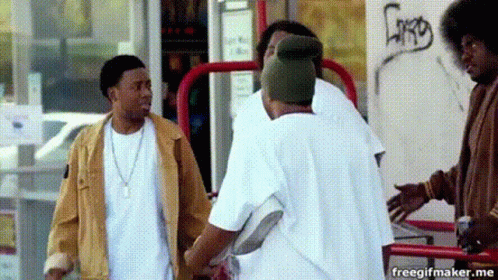 Men Standing In Front Of Graffiti Building GIF