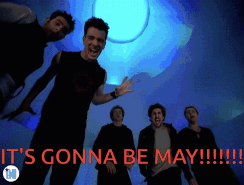 Men Standing In Front Of May Background GIF