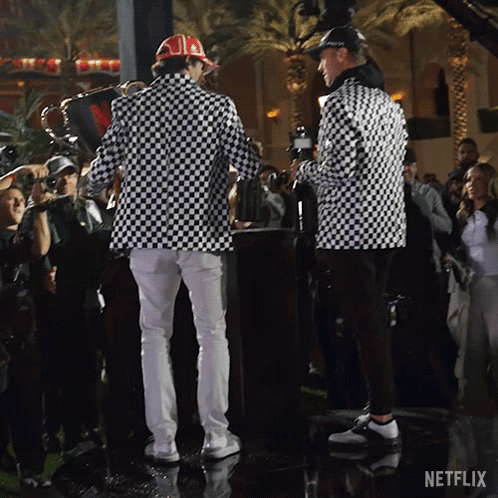 Men Standing in Front of Netflix Logo