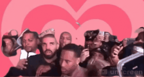 Men Standing In Front Of Pink Heart GIF