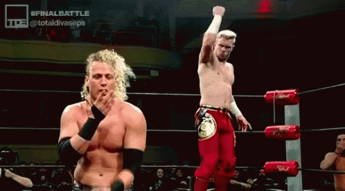 Men Standing In Wrestling Ring Fist Raised GIF