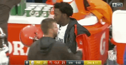 Men Standing Near NFL Table