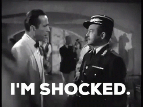 Men Standing Next to Each Other Shocked