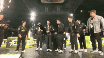 Men Standing on Stage With LG Sign