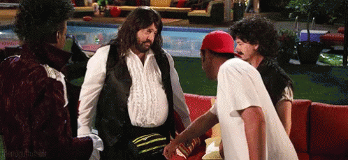 Men Talking Around Couch by Pool