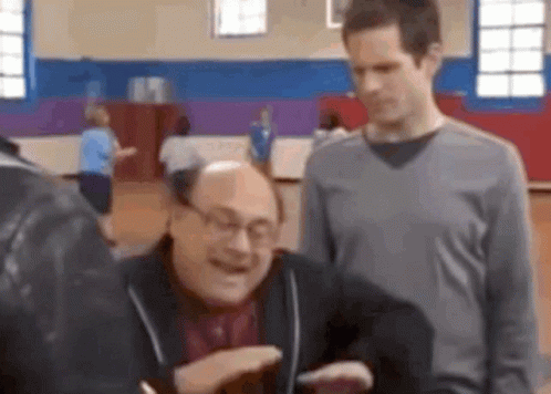 Men Talking in Gym