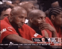 Men Watching Basketball One Listening to Degens