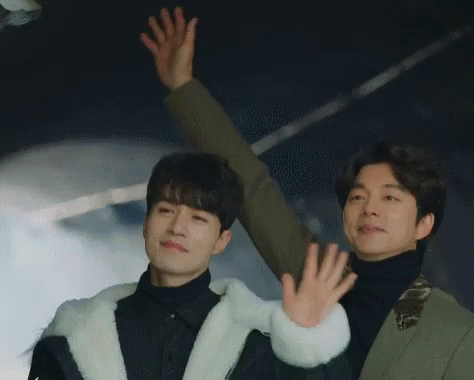Men Waving Hands in Air