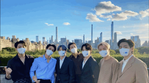 Men Wearing Face Masks with City Background