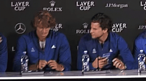 Men With Water Bottles at Table Saying Layer Cup