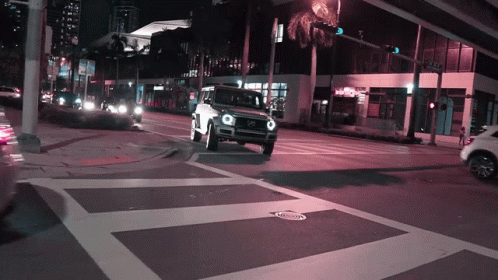 Mercedes Driving at Night With Purple Light