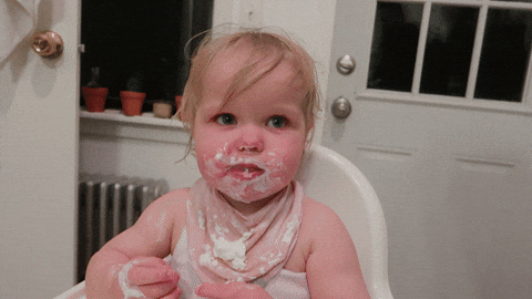 Messy Eating Toddler Licking Her Lips GIF