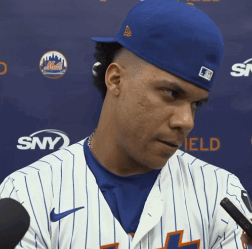 Mets Baseball Player in Blue Hat and White Jersey