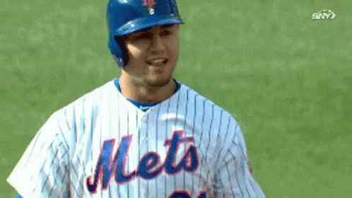 Mets Baseball Player in Blue Helmet and Striped Jersey