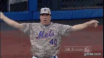Mets Baseball Player With Arms Outstretched