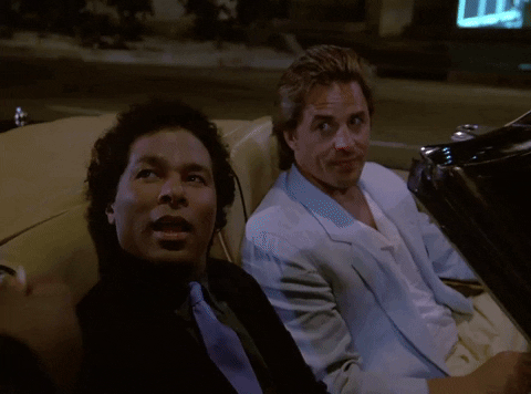 Miami Vice Ricardo Tubbs Sjhowing His Badge GIF