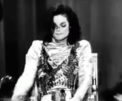 Michael Jackson Sitting in Chair Black and White Eyes Closed