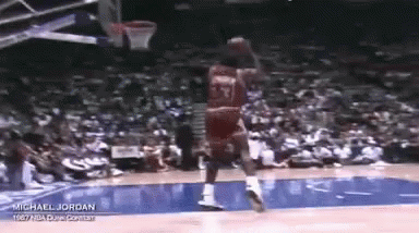 Michael Jordan Is Playing Basketball In Front Of A Crowd . GIF