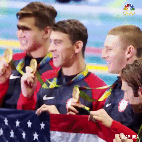 Michael Phelps Picture Taking With Other Medalists GIF