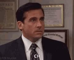 Michael Scott Making Face In Suit And Tie GIF