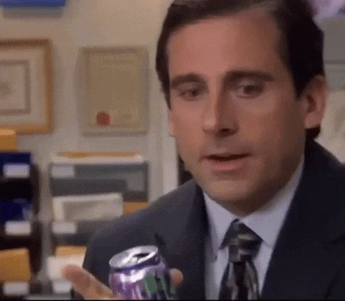 Michael Scott Is Holding A Can Of Soda In His Hand . GIF