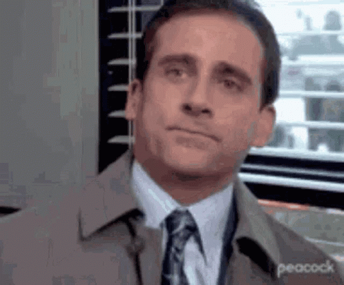 Michael Scott Making Funny Face In Suit GIF