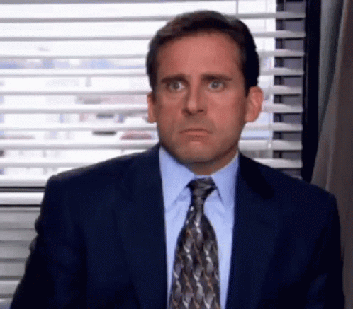 Michael Scott Making Funny Face in Suit and Tie