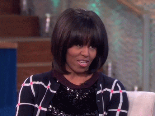 Michelle Obama in Plaid Sweater and Sequined Top