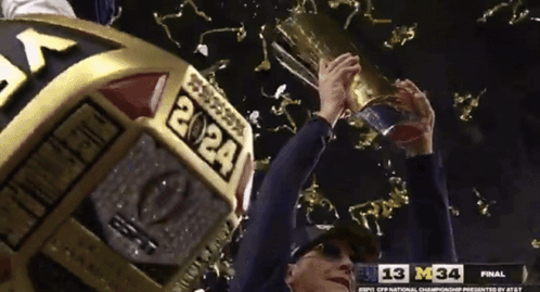 Michigan Wolverines Flexing Trophies GIF