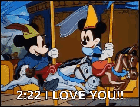 Mickey Mouse And Minnie Mouse Are Riding A Merry Go Round On A Carousel . GIF
